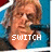 A person with light brown hair and a blue top appears in four , showing text changes from 'SWITCH' to 'FOOT' and multiple '<3' symbols