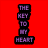 Red background with vertical purple text reading THE KEY TO MY HEART next to a silver key on white fabric.