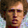Pixelated image of a person with brown hair and light skin, wearing a white shirt with blue patterns, featuring green text reading "Napoleon" at the top right.