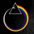A circular rainbow gradient encircles a white triangle outline on a black background, with one frame showing a gray rectangle replacing the lower-right quadrant.