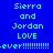 Blue background with cyan pixelated text reading "Sierra and Jordan LOVE .ever!!!!!!!!!!!" in three , repeated across a