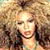 Animated contact sheet of three pixelated frames showing a woman with curly hair in different poses and lighting conditions.