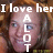Pixelated image with text overlay: 'I love her' at top, 'A LOT' vertically centered, and a blurred face in the background.