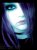Pixelated image of a face with blue and white tones, featuring a bright central light effect and dark background elements.