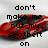 Pixelated image with black text reading "don't make me put my seatbelt on" over a red and gray blurred background.