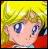 Pixelated close-up of a character with blonde hair, blue eyes, and a red garment against a yellow background.