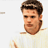 Static pixelated icon of a person with short brown hair wearing a white shirt, cropped to show upper torso and head against plain background.