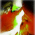 A pixelated animated icon shows a figure with orange hair and green highlights, wearing white clothing against a dark background.