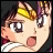 Anime character with brown hair and yellow hair accessory, wide eyes, open mouth, and pink cheeks on left; black background with white text on right.