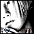 Black-and-white pixelated close-up of a person's face with short hair, showing subtle expression changes across frames.