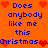 Pixelated orange background with blue text reading "Does anybody like me this Christmas..." and red heart symbols in a repeating pattern.