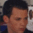 A pixelated image of a person with short dark hair, showing three sequential views where the head turns left to right and red text appears over the face.