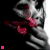 A grayscale anime-style character with red eyes covers their mouth with a hand, holding a pink heart-shaped object while small pink squares animate in the corner.