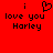 Red background with black pixelated text reading "i love you Harley" and a heart symbol replacing the 'o' in 'love'.