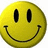 Yellow circular smiley face with black oval eyes and curved mouth; one version has pink text overlay reading 'smile!!' in pixelated font.