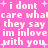 Pink background with white pixelated text repeating 'i dont care what they say im inlove with you' and small pink plus signs scattered throughout.