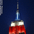Animated red and white object with blue top against dark background, showing partial visibility in