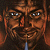 Pixelated close-up of a face with brown skin tones, dark eyes reflecting light, and a wide grin showing teeth against a dark background.