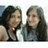 Two people in a pixelated image with cyan text on pink and gray backgrounds.