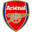 Red shield-shaped icon with blue side borders and gold trim, featuring the word 'Arsenal' in white text above a central cannon symbol.