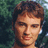 A pixelated image of a person with short brown hair against a green background, with green text on a yellow background reading 'Kerr Smith on Dawson's Creek as Jack McPhee'.