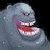 Pixelated gray creature with wide open mouth showing teeth and red tongue against dark background, next to green text reading Original Icons .com.