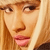 Pixelated close-up of a person with light brown hair, fair skin, and pink lips, cropped to show only the upper face and hair.