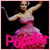 Pixelated image of a woman in a pink dress with arms raised against black background, featuring bright pink text reading 'Popular' at bottom.
