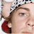 A four- of a person in various poses: wearing a white headband with red accents, a white bucket hat, and a black jacket with white trim, with the name "ryan" in white text on a black background
