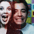 Animated sequence showing two people in four distinct poses: laughing with mouth open, smiling with closed lips, covering face with hand, and touching nose.