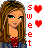 Pixelated character with long brown hair and green eyes, wearing a red top under blue denim, next to vertical "sweet" text and two pixel hearts.