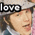 Four distinct pixelated images arranged in a with text overlays: top-left shows a person with light hair and a hat labeled 'love', top-right shows a person with dark hair labeled 'lovely', bottom-left shows four people with 'HOT!' in red text, bottom-right is empty