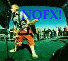 A person in orange pants and a striped shirt plays a guitar on a stage with a crowd in the background, with 'NOFX!' text in various colors above.