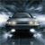 Pixelated image of a dark-colored car with headlights on, positioned on a road under a cloudy sky.