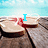 Wooden planks with bread slices on a beach background, text appears sequentially as I, LOVE, SUMMER!