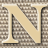 A static pixelated image of a large stylized letter N with diagonal stripes in brown and beige tones on a matching background.