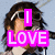 six showing a person with dark hair and sunglasses speaking into a microphone, overlaid with bright pink text reading "I LOVE NICK, JOE, AND KEVIN, THE JONA'S BROTHERS! THE JOBROS ROCK!"