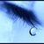A pixelated dark blue curved shape with a circular end against a light blue gradient background.