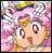 Pixelated image of a stylized face with large eyes, pink and purple background, and yellow accents on the head.