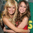 Two women embrace in a pixelated image with pink text overlays reading 'both', 'so', and 'adorable' on a white background.