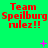 Red text on green background reads "Team Speilburg rulez!!" with pink plus and X symbols scattered across the image.