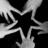 Black and white pixelated star with five points, surrounded by radiating lines on a black background.