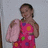A four- shows a person in a pink floral dress holding a pink object, with sequential text overlays reading LOOK AT THAT FACE!!!
