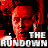 A pixelated image of a person's face in red tones with the text "THE RUNDOWN" below, set against a black background.