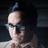 Pixelated image of a person with dark hair and glasses on the left, next to text reading 'he makes nerds look cool <3' in black block letters on white background.