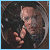 A circular icon shows a person in profile with hand raised, surrounded by dark background and blue light effects that change across frames.