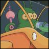 Green cartoon alien with three eyes and a pink bulbous appendage on its head, positioned behind a yellow structure with a white circular detail.