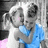 Pixelated grayscale image of two people embracing on left, blue background with cyan text fragments on right and bottom.
