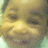 A child's face in a of four showing subtle expression changes with varying mouth positions and eye openness