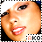 A close-up of a person's face with a white headband, red lips, and visible teeth, with the text 'AKO' below.